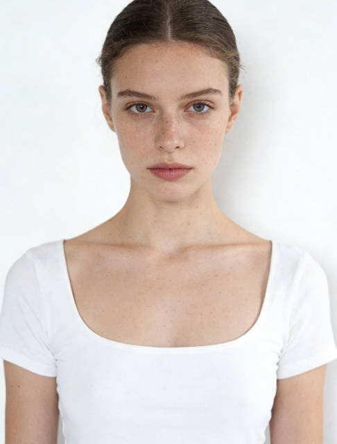 Wearing white tops against a white background